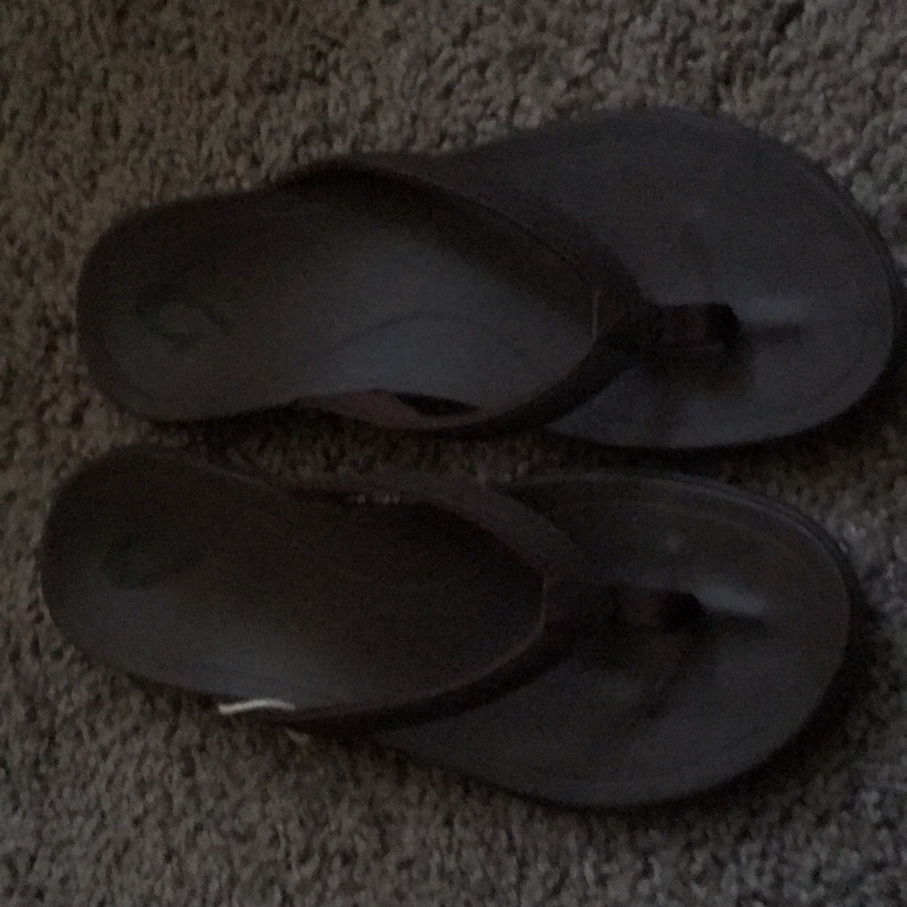 Brown leather flip flops